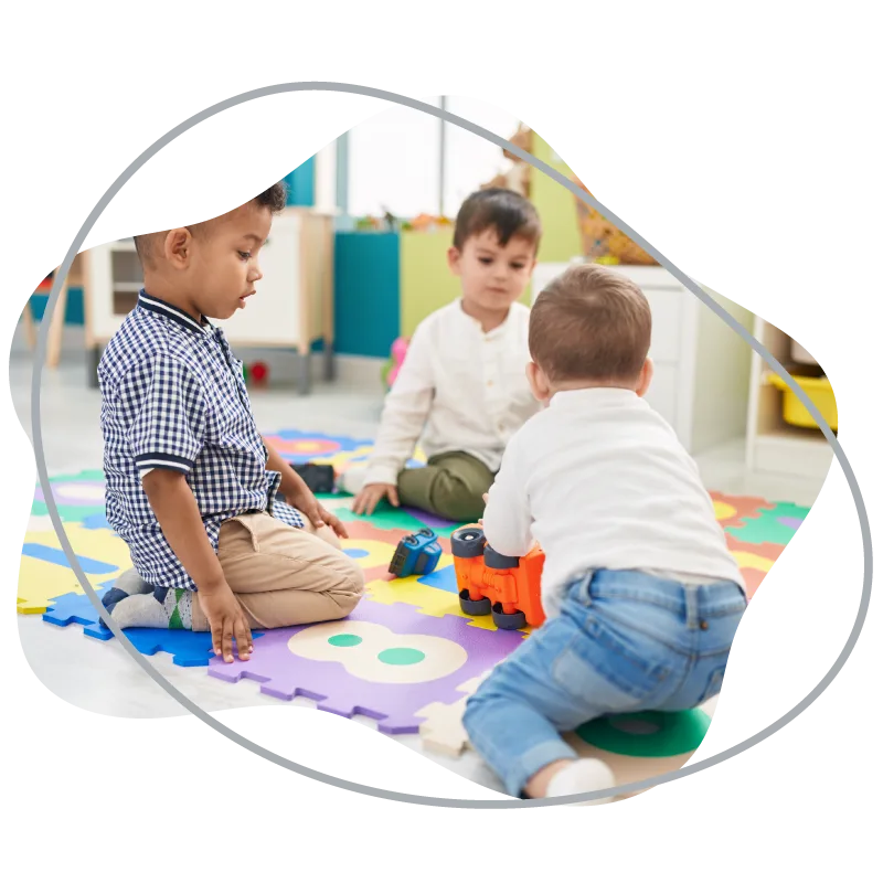 Toddlers exploring on a play mat